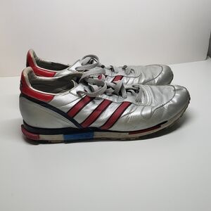Silver and black and red adidas shoes size 11.5 US.